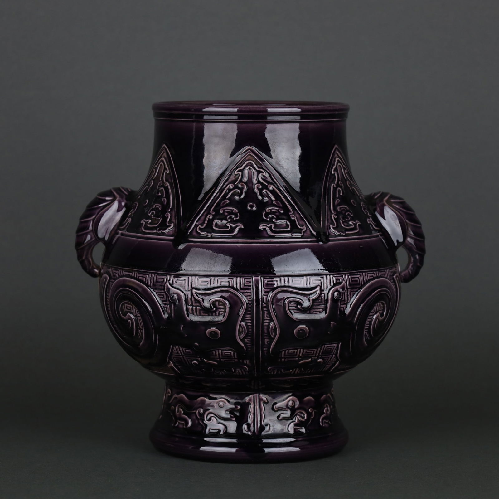 A Exquisite Aubergine Glaze Taotie Pattern Elephant-Ears Vase: A Exquisite Aubergine Glaze Taotie Pattern Elephant-Ears Vase,Qing Dynasty, China,Qianlong Six-character Mark,Size:22.3cmx22.8cm ??????????,????,?????