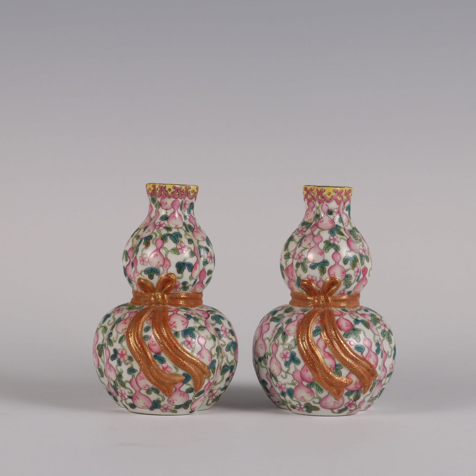 A Pair of Rare Famille Rose Gourd Pattern Three Hole Gourd Vases: A Pair of Rare Famille Rose Gourd Pattern Three Hole Gourd Vases,Qing Dynasty, China,Yongzheng Four-character Mark,Size:11.2cmx6.6cm ????????????,????,??????