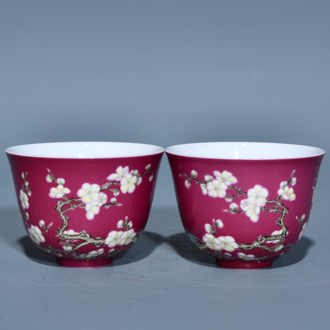 A Pair of Exquisite Ruby Red-Glazed Famille-Rose Plum Blossom Pattern Cups: A Pair of Exquisite Ruby Red-Glazed Famille-Rose Plum Blossom Pattern Cups,Qing Dynasty,China,Yongzheng Four-character Mark,Size:1.6inx2.2in 