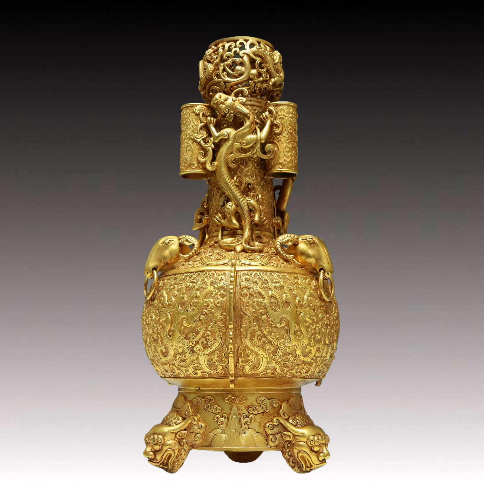 A Marvelous Gilt-Bronze 'Dragon& Phoenix' Tripod Vase: A Marvelous Gilt-Bronze 'Dragon& Phoenix' Tripod Vase. Cast with sinuous chi-dragons with curled, bifurcated tails. Chinese Qing Dynasty. Qianlong Four-Character Mark. Size:9.4inx18.9in 