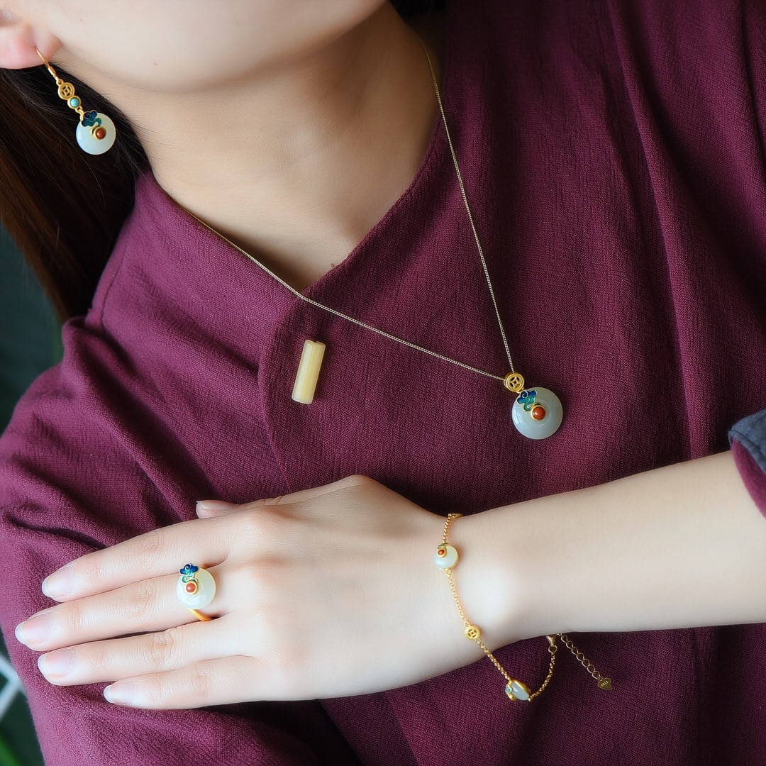 A Set of Fine Sterling Silver-Gold Plated Inlaid White Jade Jewelrys: A Set of Fine Sterling Silver-Gold Plated Inlaid White Jade Jewelrys,Size:(Earrings)0.6inx0.6in,(Pendant)0.7inx0.7in,(Ring)0.6inx0.6in,(Bracelet)0.3inx0.3in 