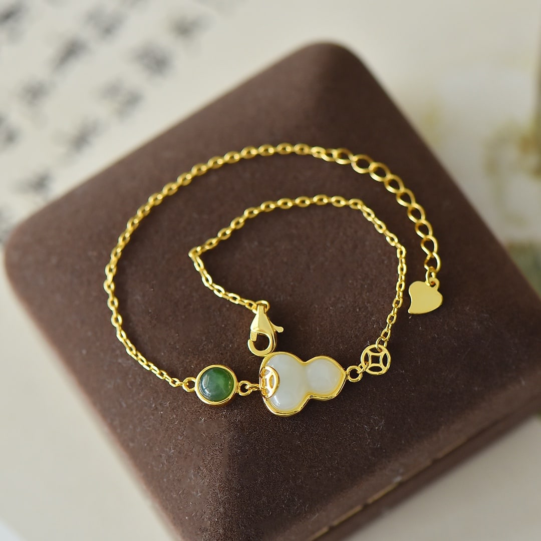 An Exquisite Sterling Silver-Gold Plated Inlaid White Jade Bracelet: An Exquisite Sterling Silver-Gold Plated Inlaid White Jade Bracelet,Size:0.4inx0.5in 纯银镀金镶白玉手链