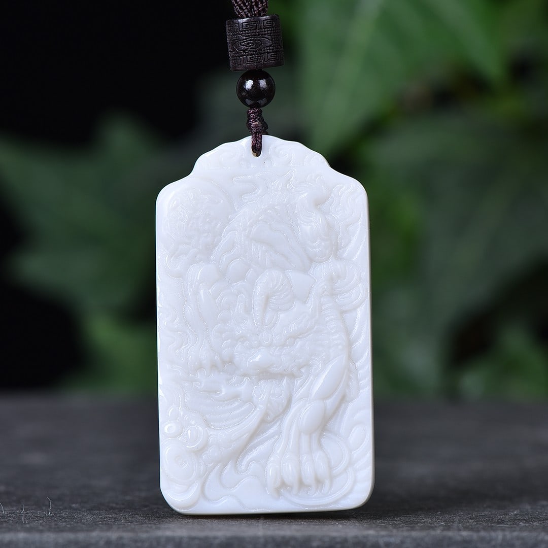 An Exquisite White Jade Wealth-Attracting Creature Pendant: An Exquisite White Jade Wealth-Attracting Creature Pendant,Size:1.3inx2.3in 白玉貔貅挂件