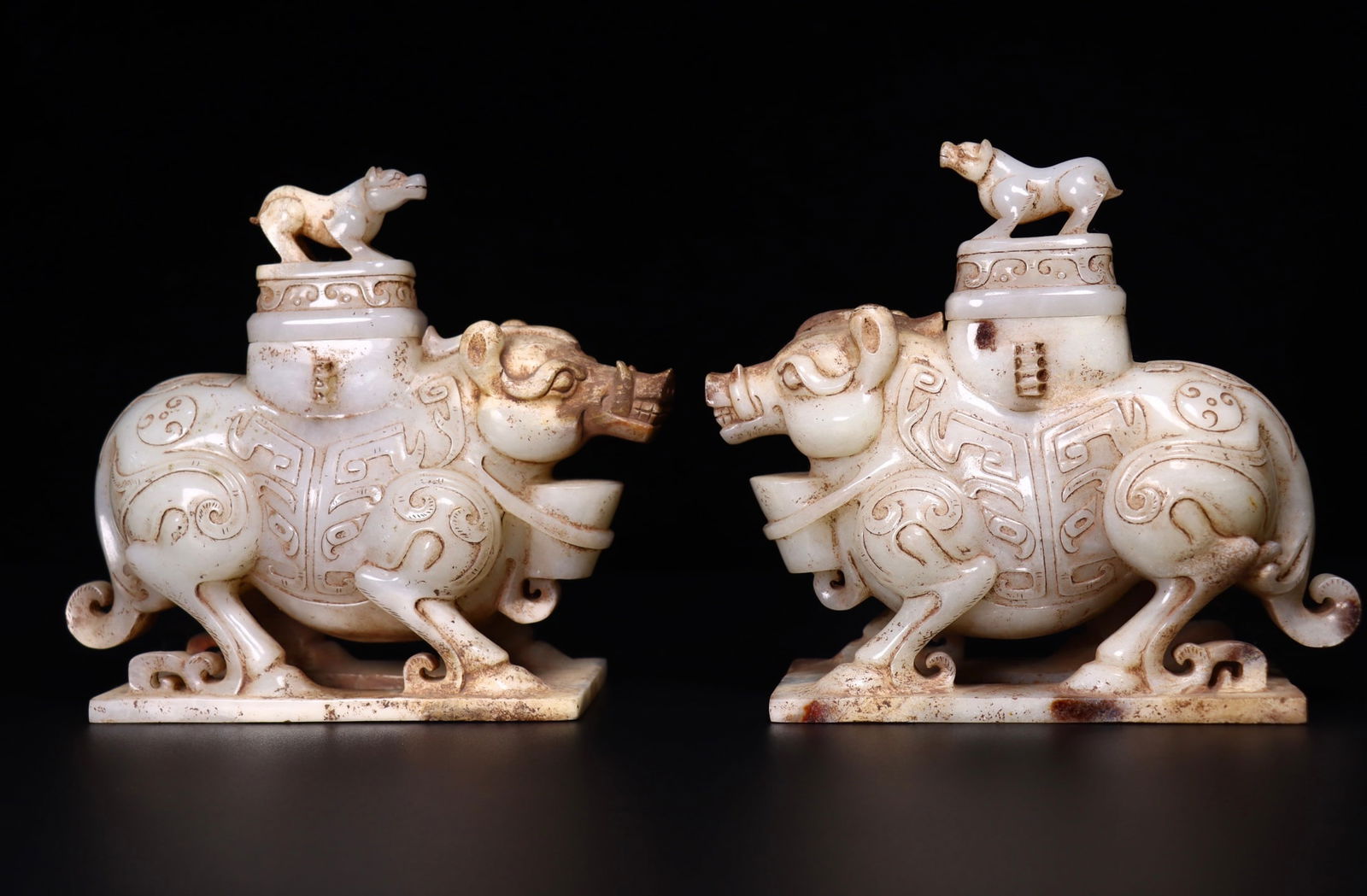 A Pair of Exquisite White Jade Pig-Shaped Vases: A Pair of Exquisite White Jade Pig-Shaped Vases,Qing Dynasty, China,Size:7.3inx2.8inx6.3in,Weight:1178g*2 一对白玉猪形瓶,中国清代
