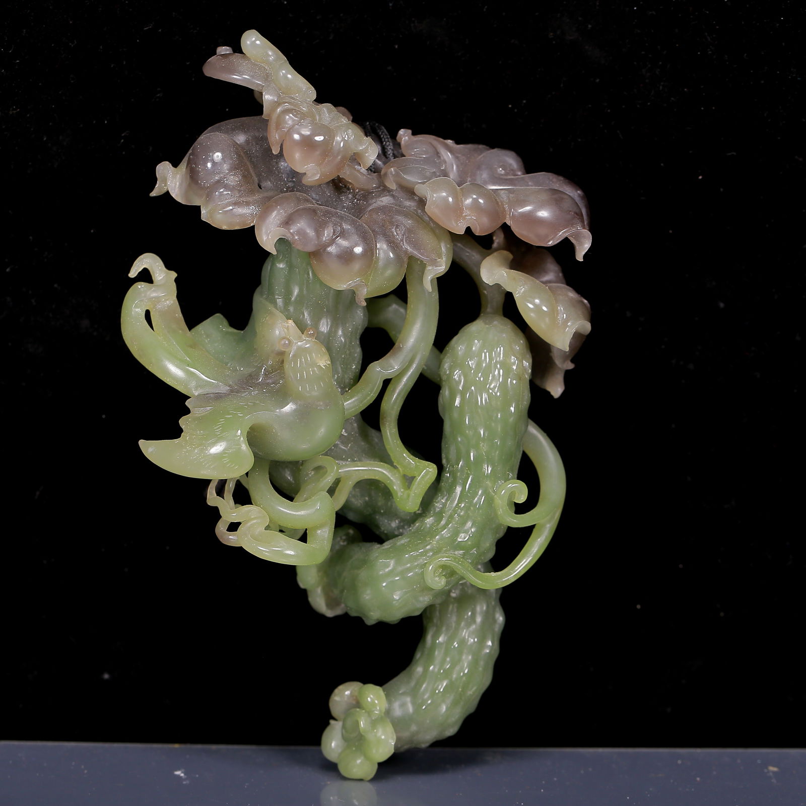 An Exquisite Jasper Flower and Fruit Pattern Pendant: An Exquisite Jasper Flower and Fruit Pattern Pendant,Qing Dynasty, China,Size: 3.9inx1.6inx5.5in,Weight:395g 碧玉花果纹挂件，清代