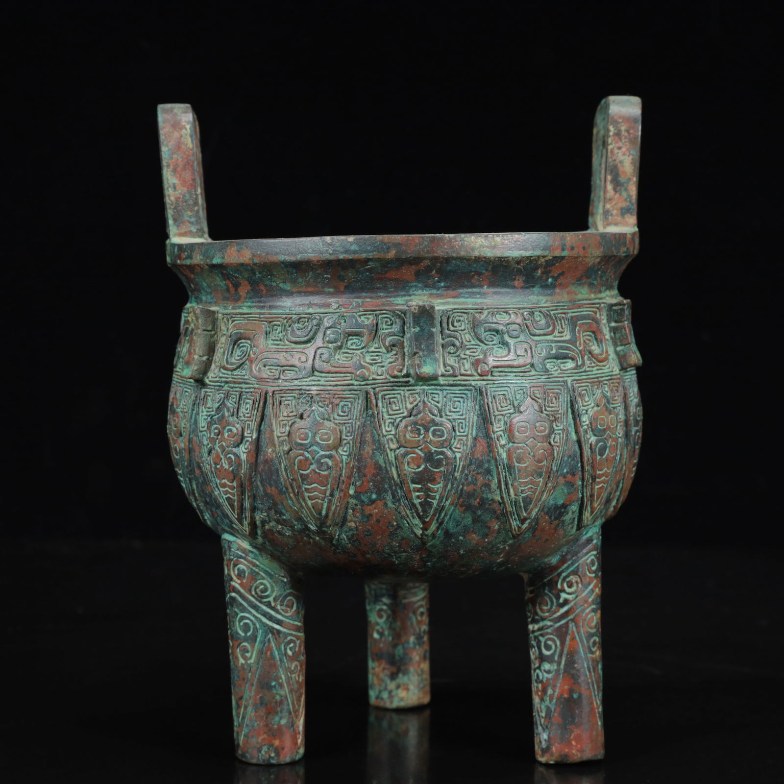 An Archaic Bronze Figure-Face Pattern Double-Ears and Tripod Censer: An Archaic Bronze Figure-Face Pattern Double-Ears and Tripod Censer,the Warring States Period in China,Size:5.5inx7.5in,Weight:1300g 