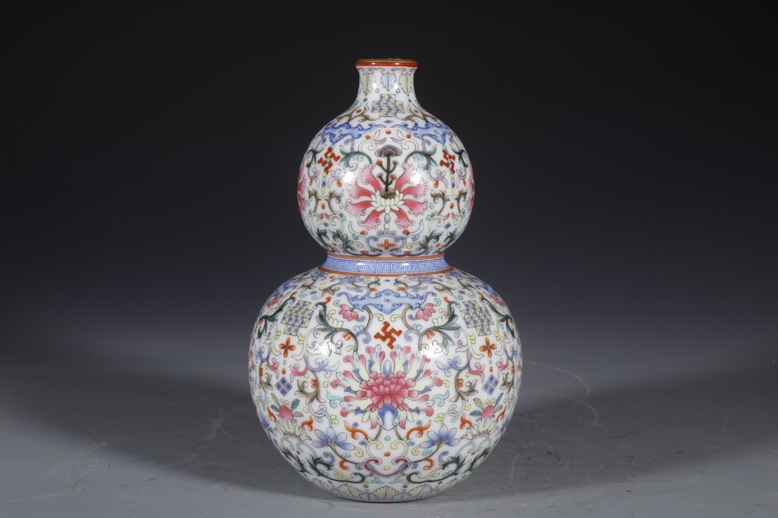 An Exquisite Enamel Lotus Pattern Gourd-Shaped Vase: An Exquisite Enamel Lotus Pattern Gourd-Shaped Vase,Qing Dynasty,China,Qianlong Four-character Mark,Size:8.3inx2.8in 