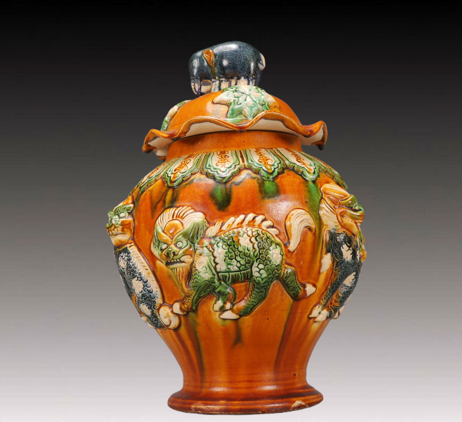 A Rare Tang Tri-Color Glazed Pottery Auspicious Beast Pattern Cover Jar: A Rare Tang Tri-Color Glazed Pottery Auspicious Beast Pattern Cover Jar,Tang Dynasty, China,Size:9.8inx10.2inx13.4in,Weight:4000g 