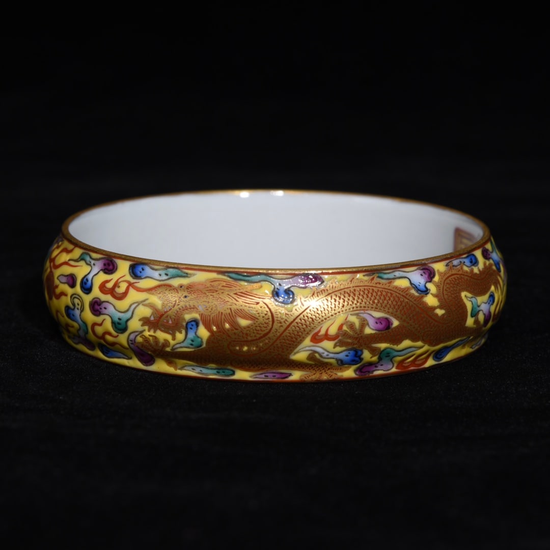 An Exquisite Enamel Gilt Auspicious Cloud and Dragon Pattern Bracelet: An Exquisite Enamel Gilt Auspicious Cloud and Dragon Pattern Bracelet,Qing Dynasty,China,Qianlong Four-character Mark,Size:0.8inx2.8in 