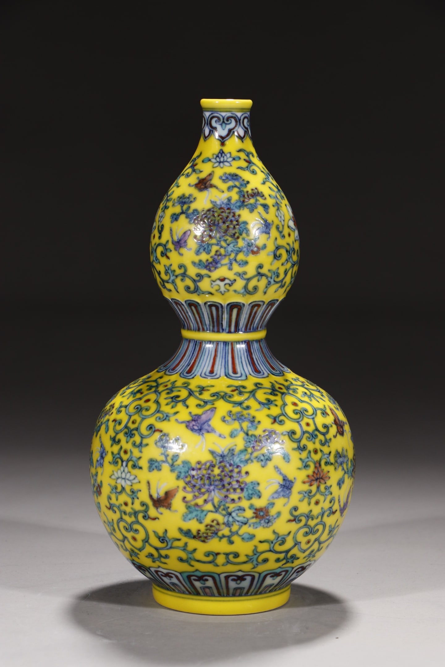 An Exquisite Yellow Ground Doucai Lotus Pattern Gourd-Shaped Vase: An Exquisite Yellow Ground Doucai Lotus Pattern Gourd-Shaped Vase,Qing Dynasty,China,Yongzheng Six-character Mark,Size:9.1in 