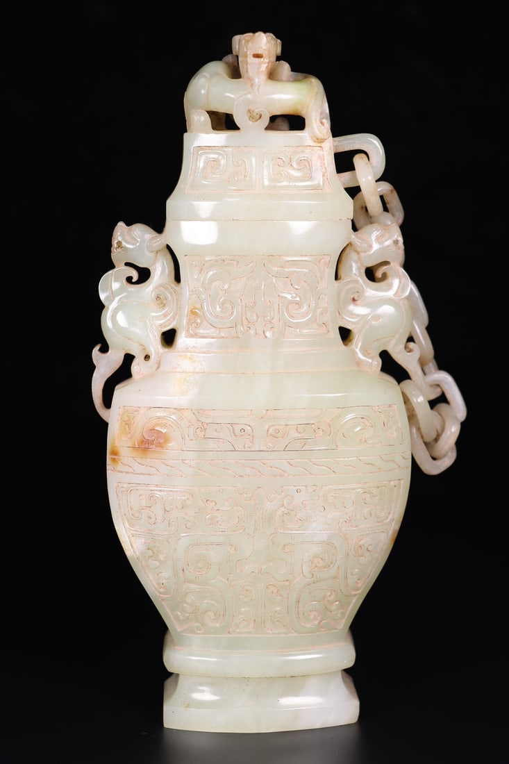 An Exquisite White Jade Beast-Face Pattern Dragon-Ears Vase with Cover: An Exquisite White Jade Beast-Face Pattern Dragon-Ears Vase with Cover,Qing Dynasty, China,Size:4.3inx2inx8.5in,Weight:821g 白玉兽面纹龙耳盖瓶,