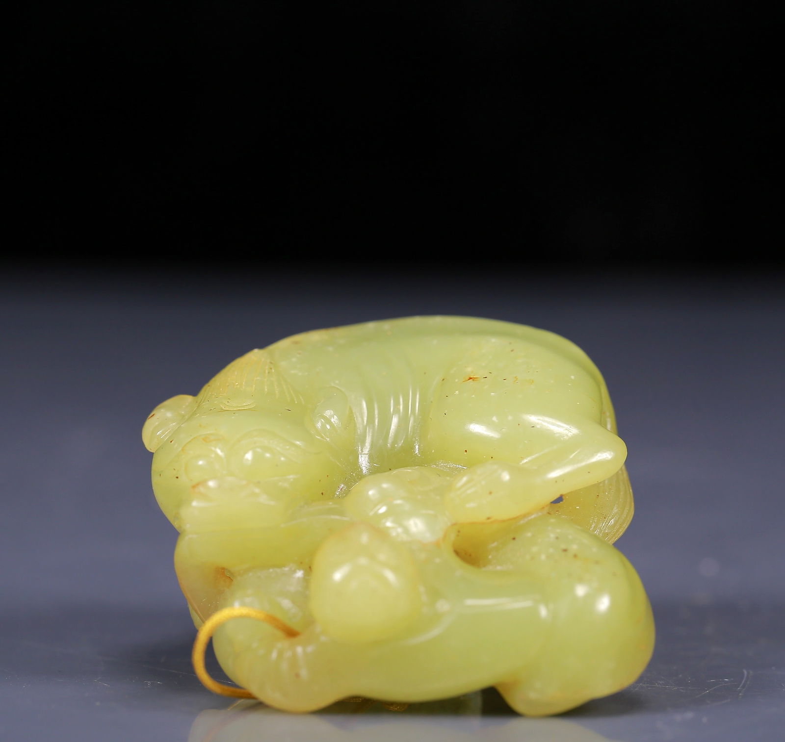 An Exquisite Yellow Jade Figure and Beast Pattern Pendant: An Exquisite Yellow Jade Figure and Beast Pattern Pendant,Qing Dynasty, China,Size:2.4inx2inx1in,Weight:90g 黄玉人物驯兽挂件，清代