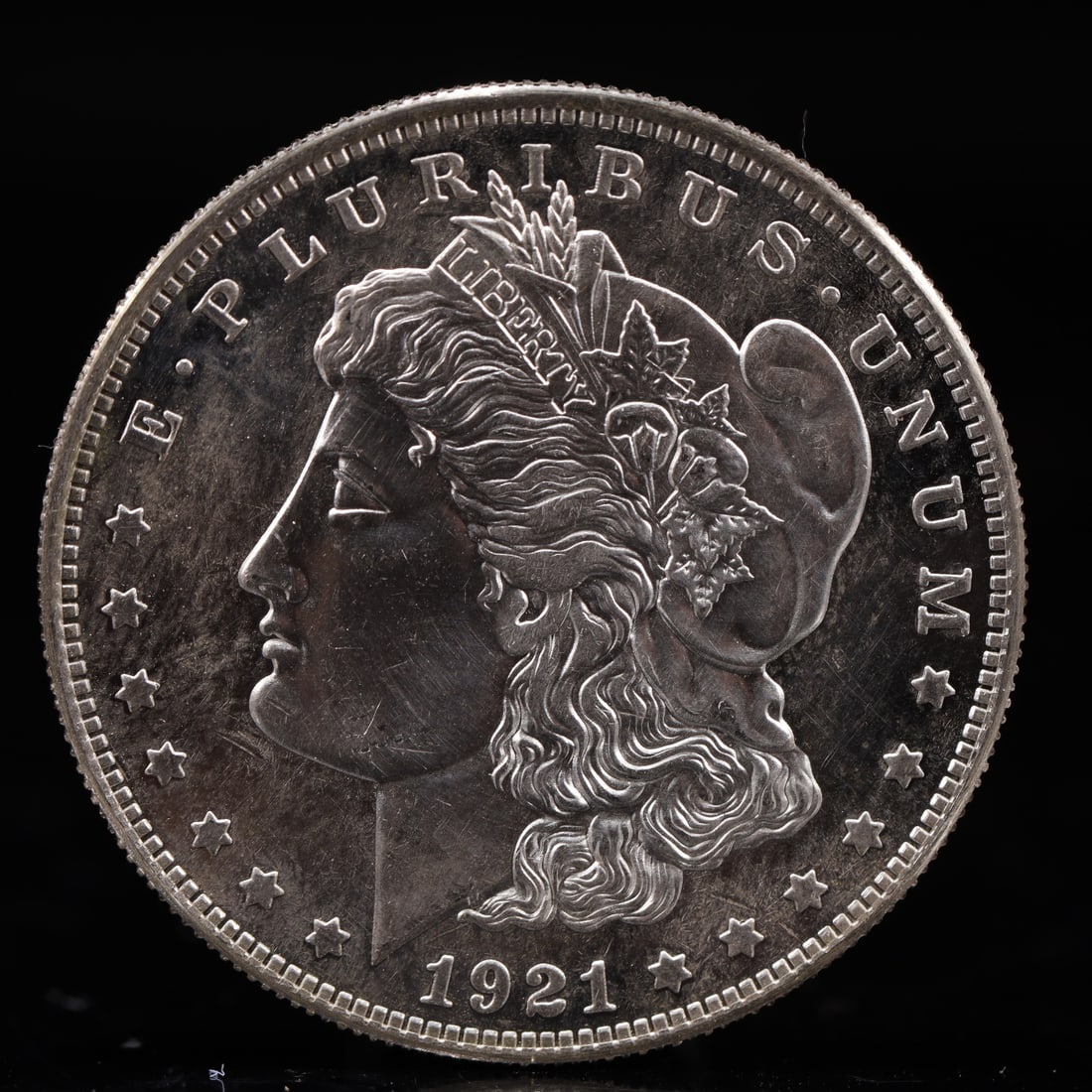 USA Morgan Dollar 1921 Coin: Obv: profile bust with date below and E PLURIBUS UNUM legend and stars around. Rev: eagle with In God we trust above within wreath with UNITED STATES OF AMERICA ONE DOLLAR legend. IN GOD WE TRUST /