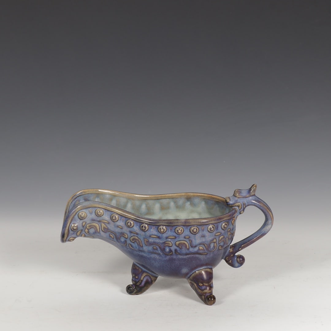 An Exquisite Jun yao Purple Glazed Dragon Pattern Tripod Goblet: An Exquisite Jun yao Purple Glazed Dragon Pattern Tripod Goblet,Song Dynasty,China,Size:4.8inx8.9in 钧窑紫釉龙纹三足爵杯,中国