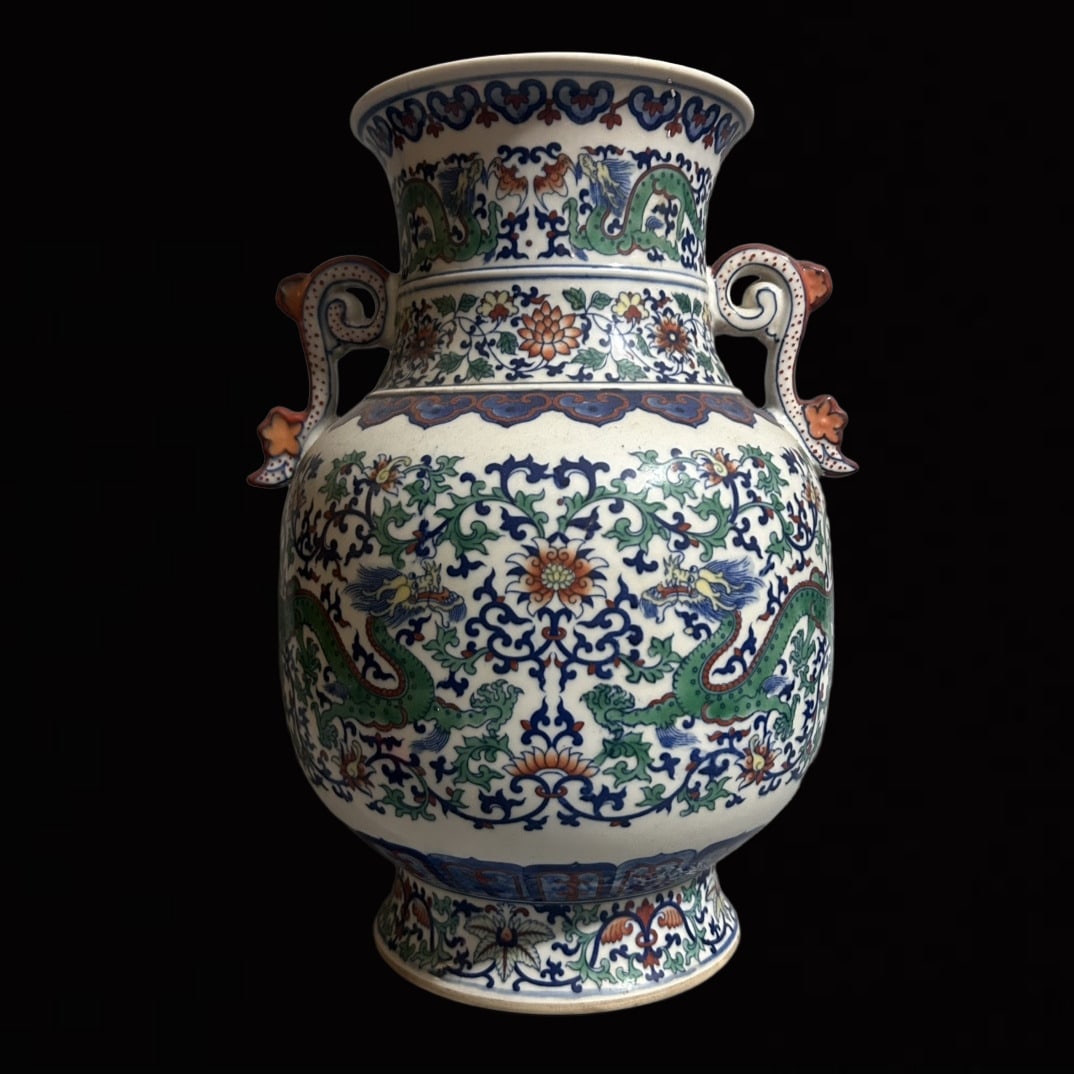 An Exquisite Doucai Lotus and Dragon Pattern Double-Ears Vase: An Exquisite Doucai Lotus and Dragon Pattern Double-Ears Vase,Qing Dynasty,China,Qianlong Six-character Mark,Size:7.3inx12.6in