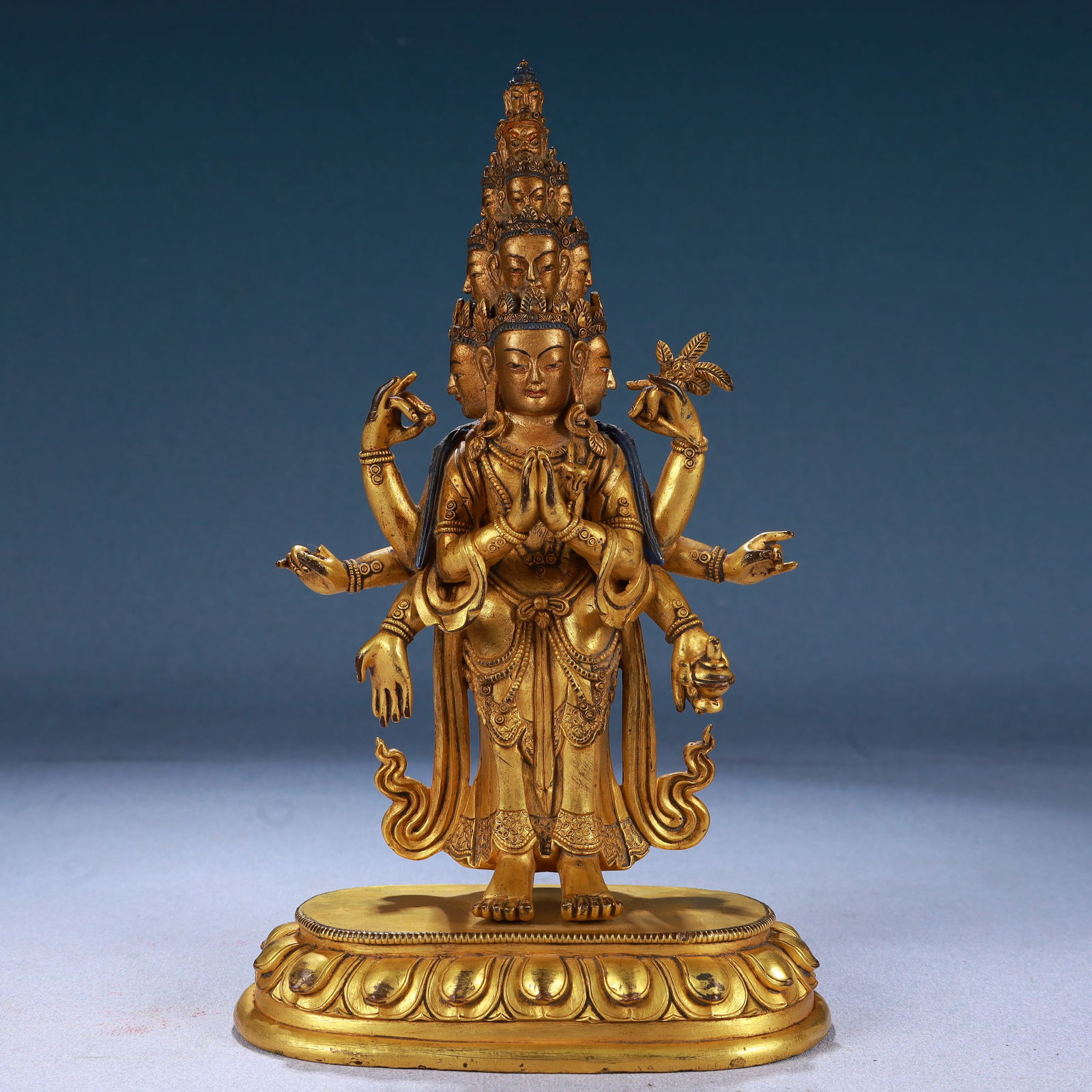 A Solemn Gilt Bronze Eleven-Headed and Six-Armed Guanyin: A Solemn Gilt Bronze Eleven-Headed and Six-Armed Guanyin,Qing Dynasty, China,Size:5.1inx2.8inx8.3in,Weight:1200g 