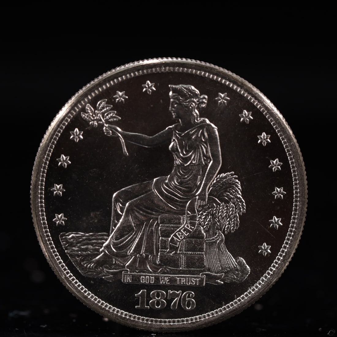 USA Trade Dollar 1876 Coin: American coin. Obverse: Liberty seated on a pedestal facing the sea to the left holding olive branches surrounded by 13 stars. IN GOD WE TRUST / LIBERTY / 1876. Reverse: An eagle holding branches with