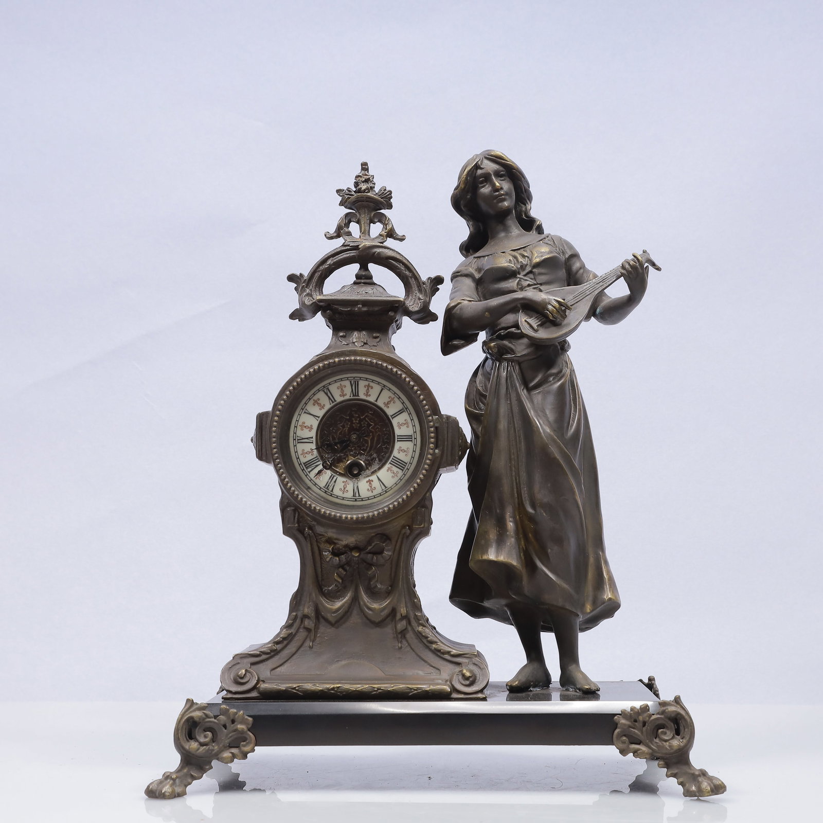 An Exquisite Copper Figure Table Clock Ornament: An Exquisite Copper Figure Table Clock Ornament,17th Century,Size:12.6inx7.1inx15.7in,Weight:7250g 铜人物座钟摆件,17世纪