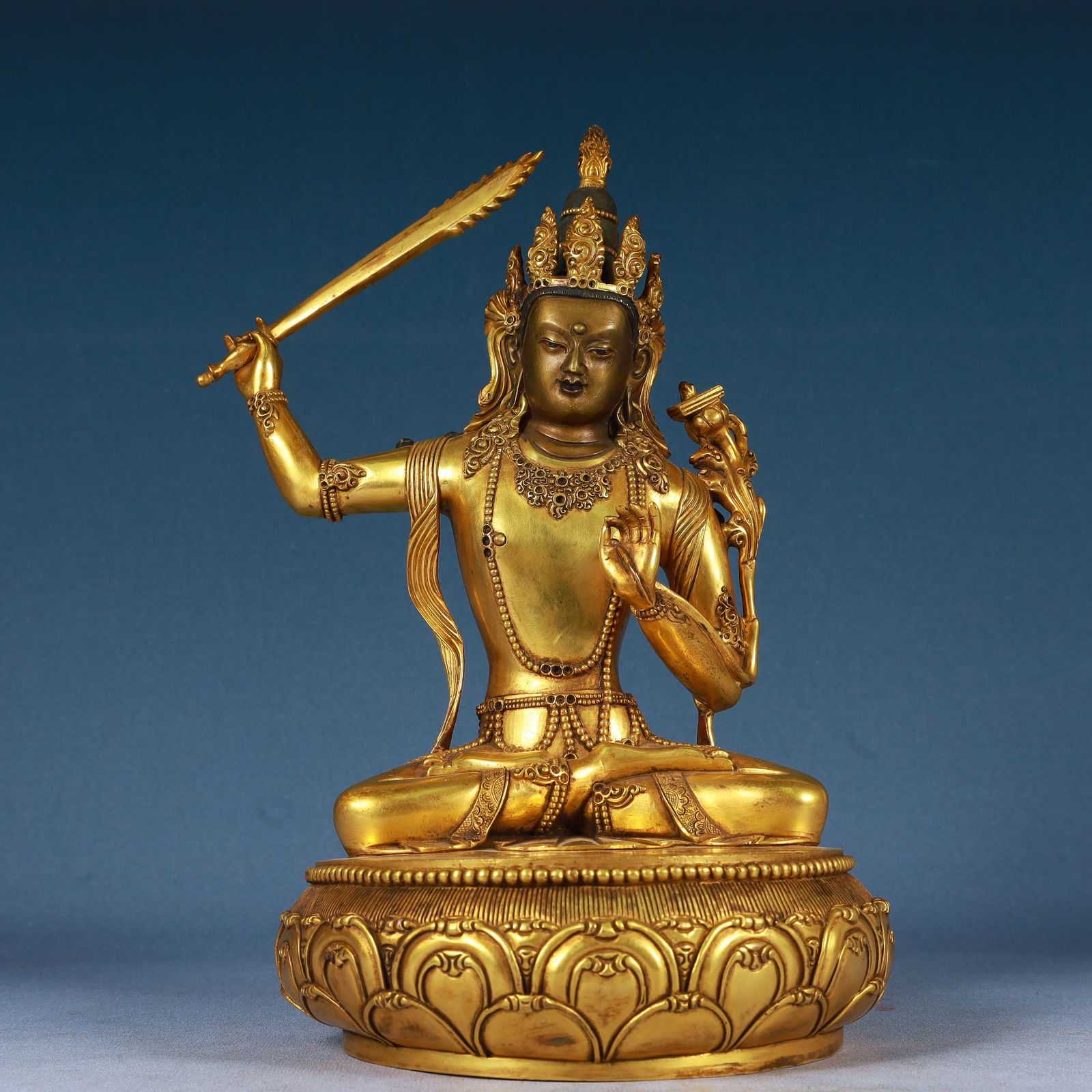 A Solemn Gilt Bronze Statue of Manjusri,With Inscription: A Solemn Gilt Bronze Statue of Manjusri,With Inscription,Qing Dynasty, China,Qianlong Mark,Size:7.5inx12.6in,Weight:6000g 