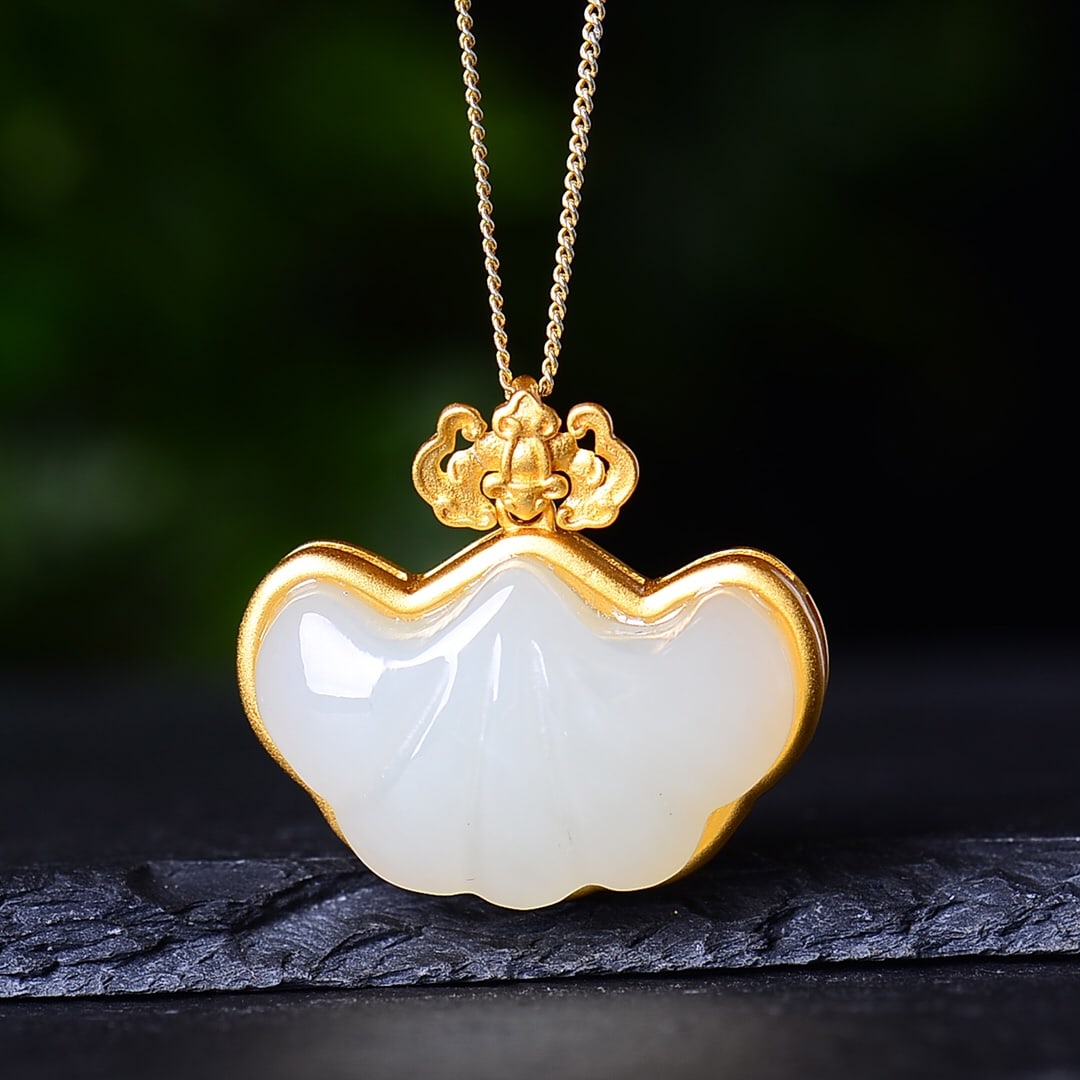 An Exquisite Sterling Silver-Gold Plated Inlaid White Jade Pendant: An Exquisite Sterling Silver-Gold Plated Inlaid White Jade Pendant,Size:0.6inx0.9in 纯银镀金镶白玉吊坠