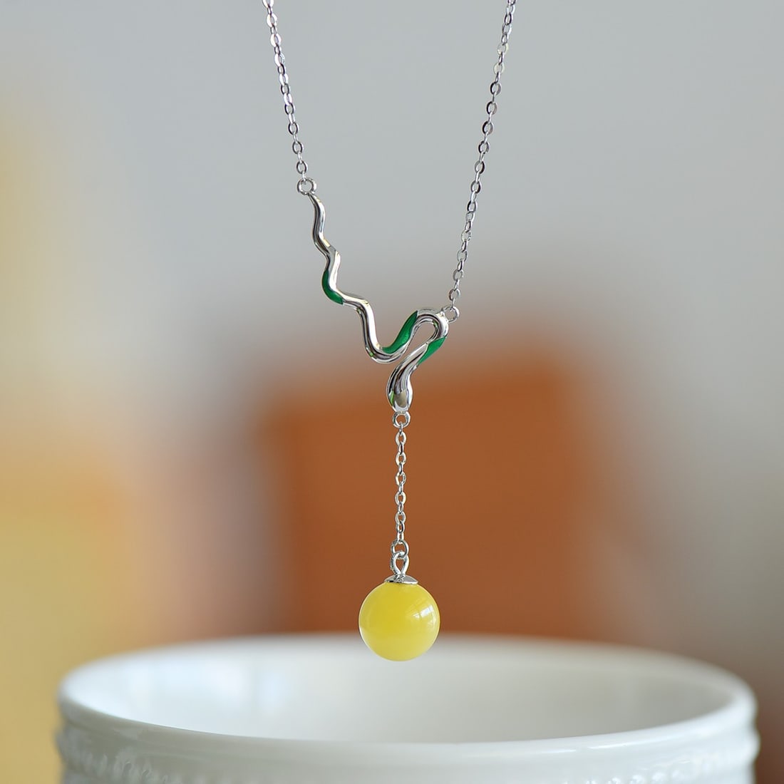 An Exquisite Sterling Silver Inlaid Amber Enamel Pendant: An Exquisite Sterling Silver Inlaid Amber Enamel Pendant 纯银镶琥珀珐琅吊坠