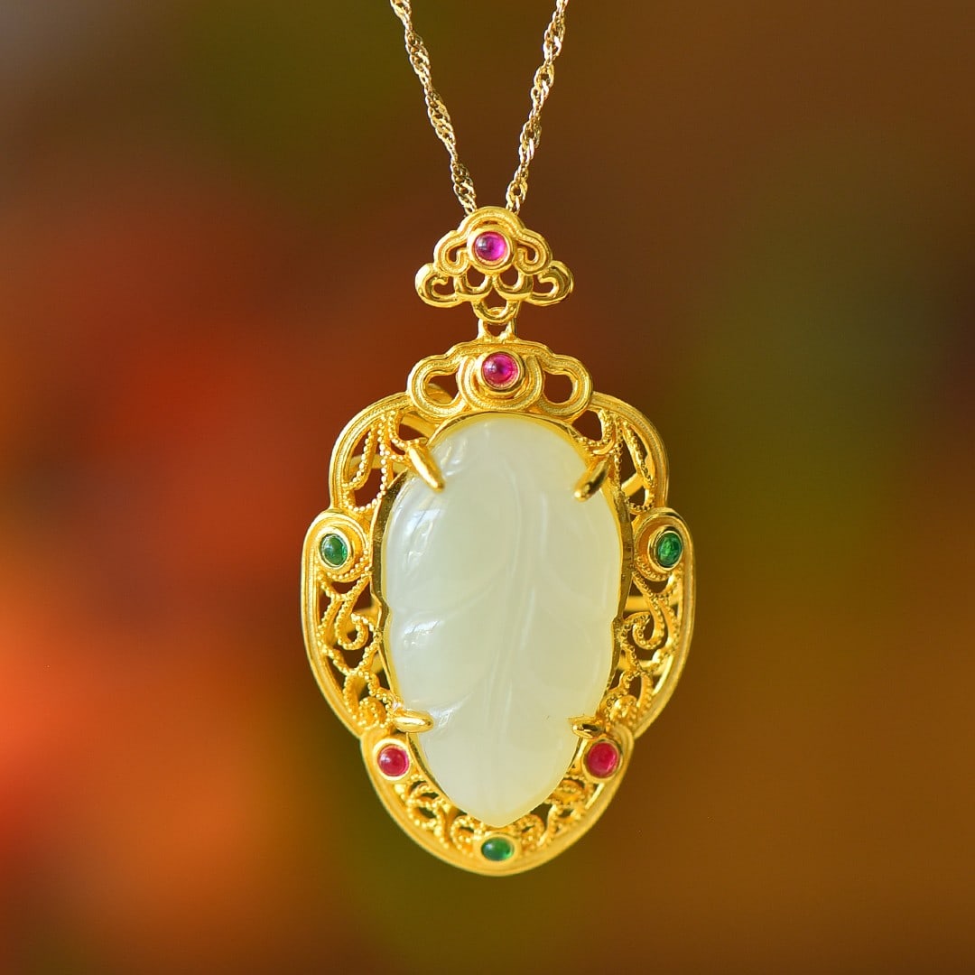 An Exquisite Sterling Silver-Gold Plated Inlaid White Jade Pendant: An Exquisite Sterling Silver-Gold Plated Inlaid White Jade Pendant,Size:0.7inx1.2in 纯银镀金镶白玉吊坠
