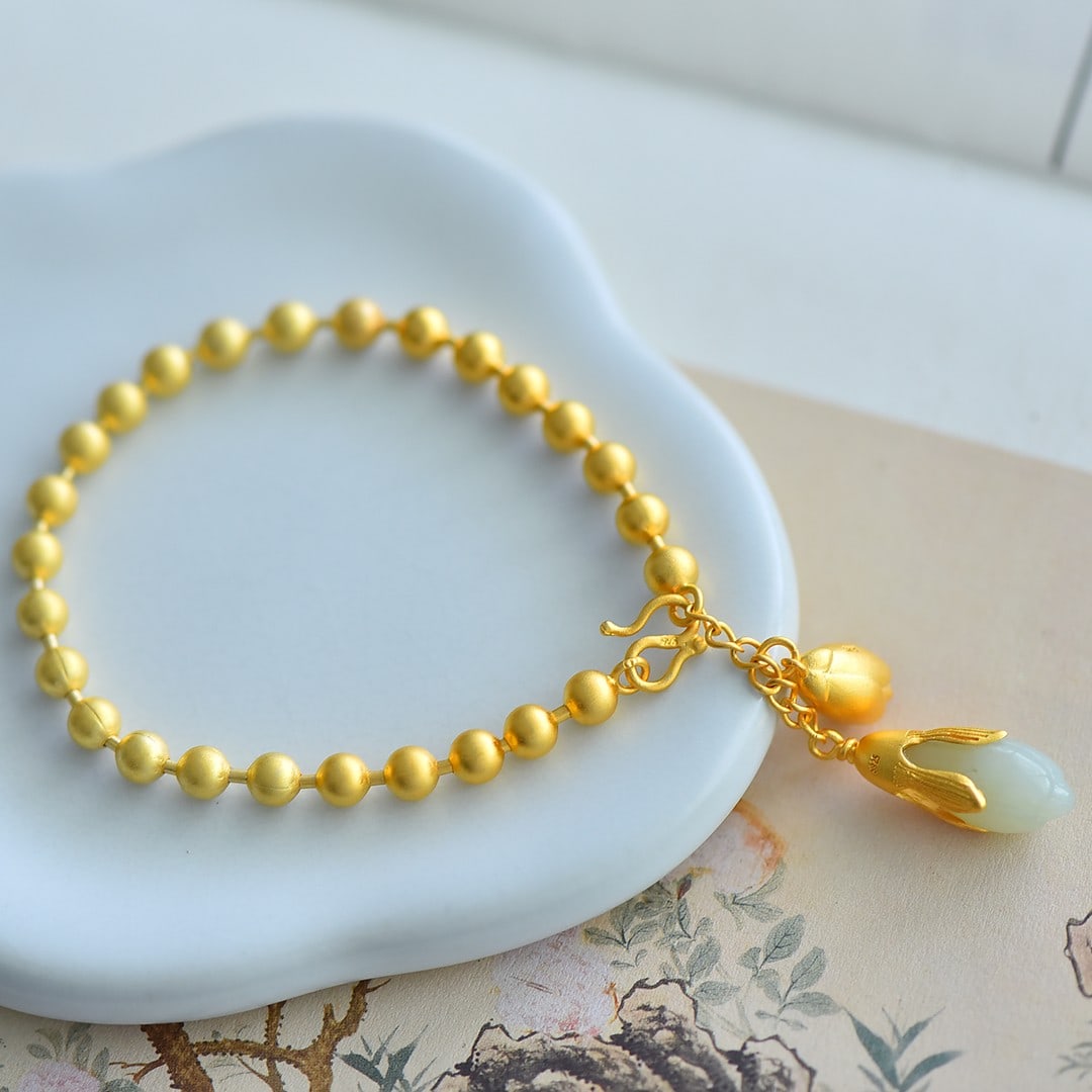 An Exquisite Sterling Silver-Gold Plated Inlaid White Jade Bracelet: An Exquisite Sterling Silver-Gold Plated Inlaid White Jade Bracelet,Size:0.4inx0.6in 纯银镀金镶白玉手链