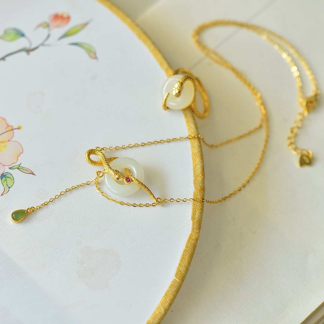 An Exquisite Sterling Silver-Gold Plated Inlaid White Jade Pendant: An Exquisite Sterling Silver-Gold Plated Inlaid White Jade Pendant 纯银镀金镶白玉吊坠