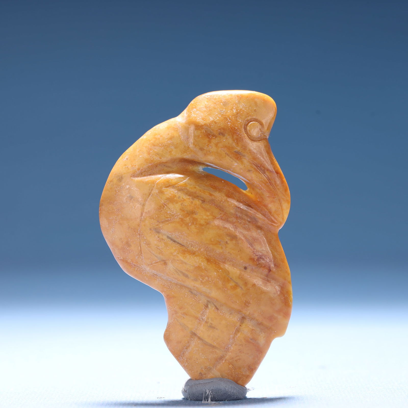 An Archaic Hongshan Culture Yellow Jade Crane Ornament: An Archaic Hongshan Culture Yellow Jade Crane Ornament,Ancient Time,China,Size:1.7inx0.4inx2.9in,Weight:40.8g 红山文化黄玉鹤摆件,中国&