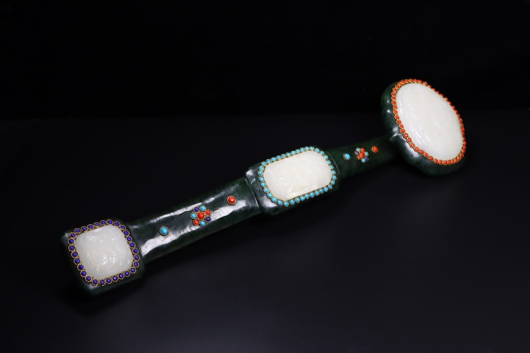 A Exquisite Hotan Jasper Ruyi Ornament: A Exquisite Hotan Jasper Ruyi Ornament,Qing Dynasty, China,Size:17.7inx4.7inx2.6in,Weight:1303g 和田碧玉如意摆件,中国清代