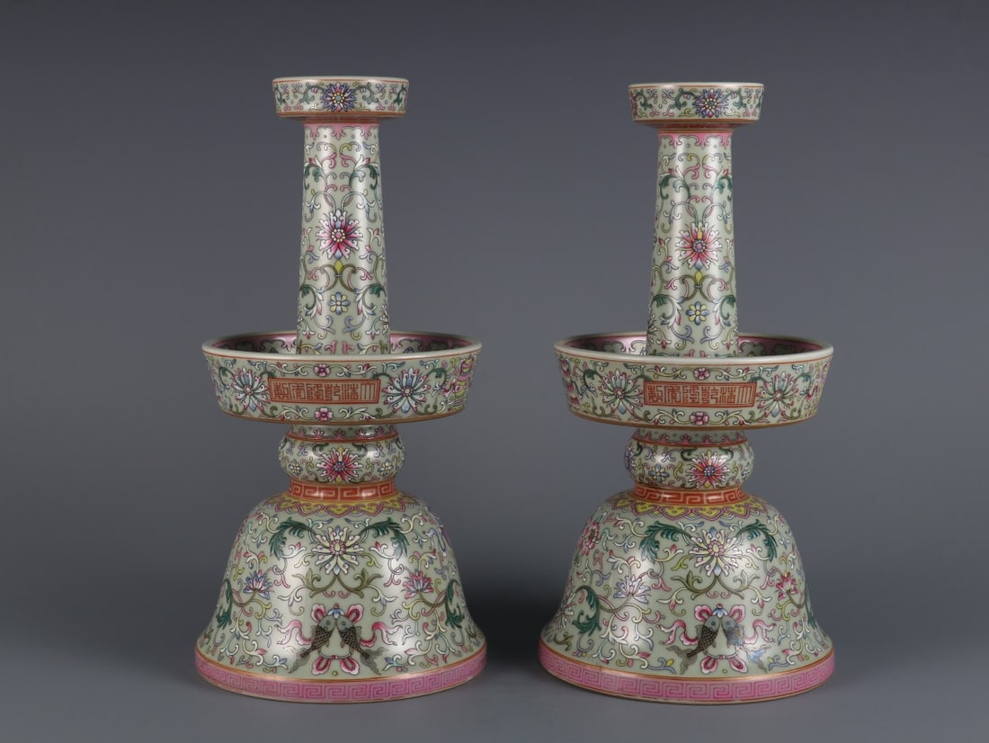 A Pair of Rare Bean Green Glaze Famille Rose Interlocking Lotus Supporting Eight Treasures Pattern: A Pair of Rare Bean Green Glaze Famille Rose Interlocking Lotus Supporting Eight Treasures Pattern Candlesticks,Qing Dynasty, China,Qianlong Six-character Mark,Size:12inx5.7in 