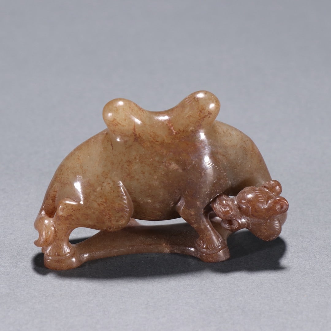 A Exquisite Hotan Jade Camel Ornament: A Exquisite Hotan Jade Camel Ornament,Han Dynasty, China,Size:2.9inx1.9in,Weight:103.1g 和田玉骆驼摆件,中国汉代