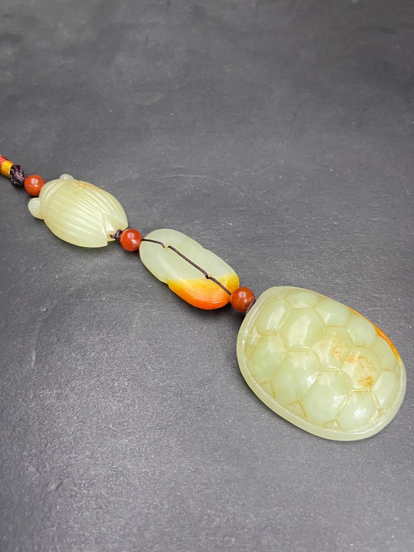 An Exquisite White Jade Cicada Pendant: An Exquisite White Jade Cicada Pendant Han Dynasty, China Size:1.9inx1.6inx0.6in Weight:87g白玉富贵缠身三件套 中国汉代 Siz