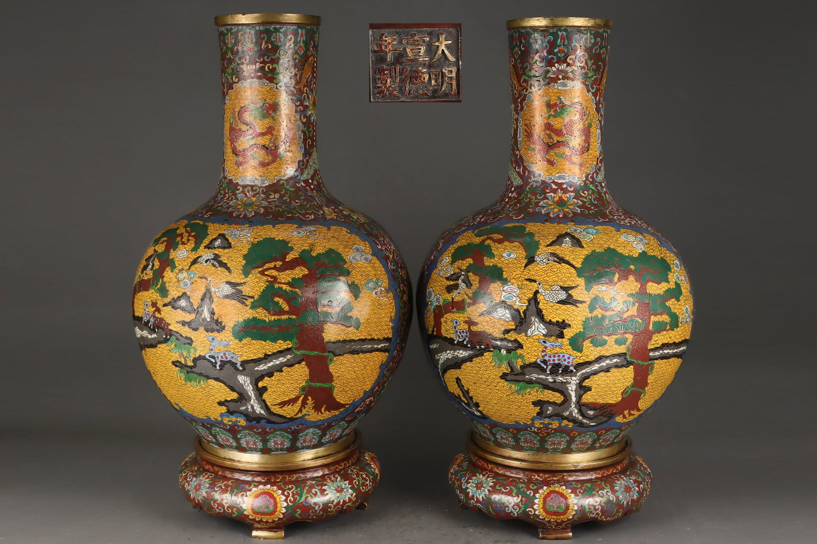 A Pair of Exquisite Cloisonne Pine and Crane Pattern Lotus Pattern Vase: A Pair of Exquisite Cloisonne Pine and Crane Pattern Lotus Pattern Vase Ming Dynasty, China Xuande Six-character Mark Size:26.8inx15in Weight:69550g铜景泰蓝鎏金(