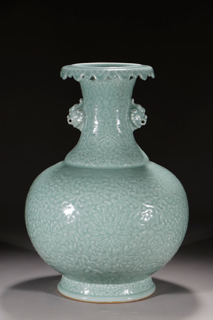 An Exquisite Celadon Glazed Lotus Pattern Double-Ears Vase: An Exquisite Celadon Glazed Lotus Pattern Double-Ears Vase Qing Dynasty, China Qianlong Six-character Mark Size:19.5in粉青釉缠枝花卉双耳尊 &