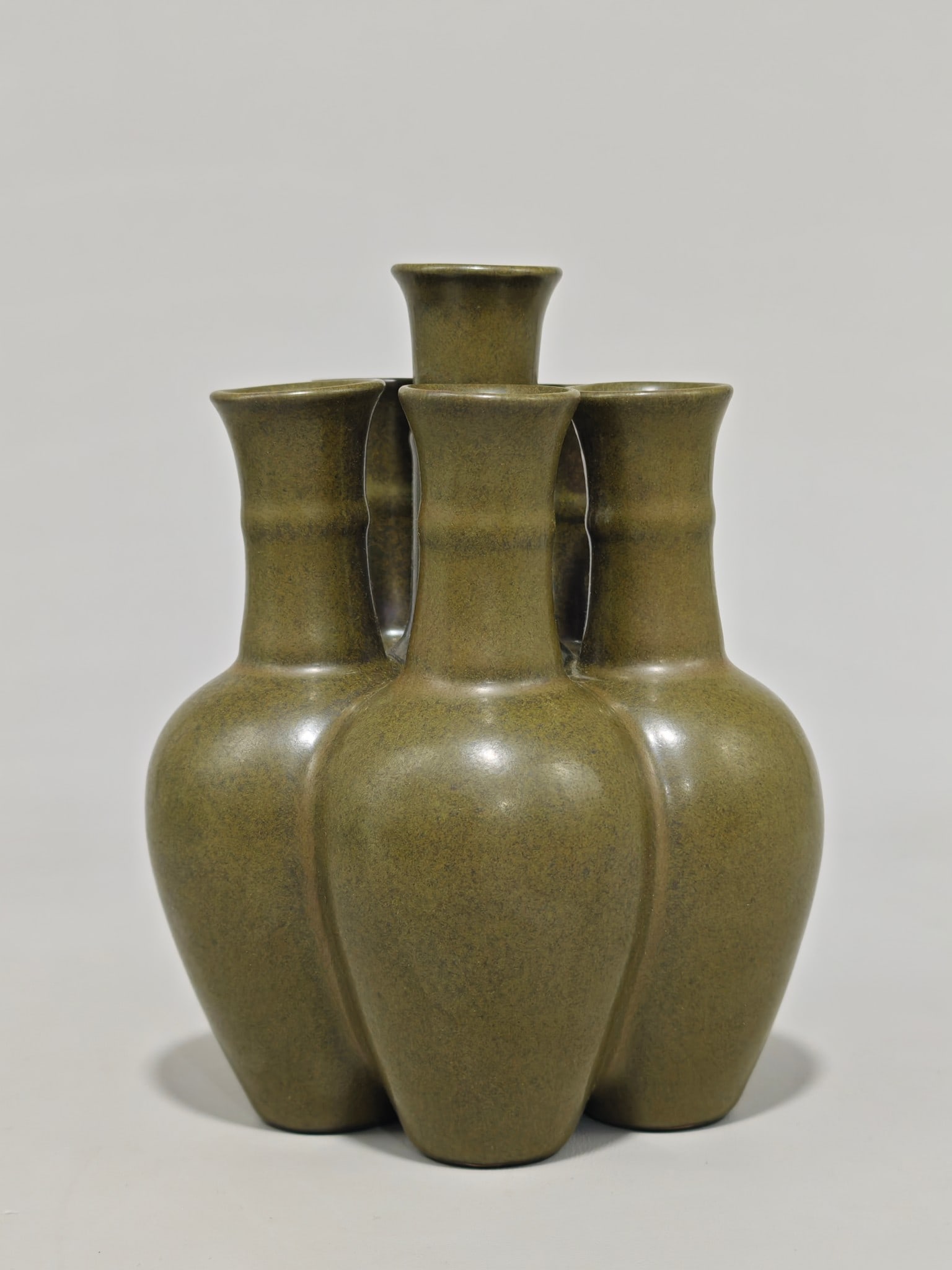 An Exquisite Chai yao Teadust Glazed Vase: An Exquisite Chai yao Teadust Glazed Vase Qing Dynasty, China Qianlong Four-character Mark Size:7.1inx5.5in柴窑茶叶墨五管瓶 中国清