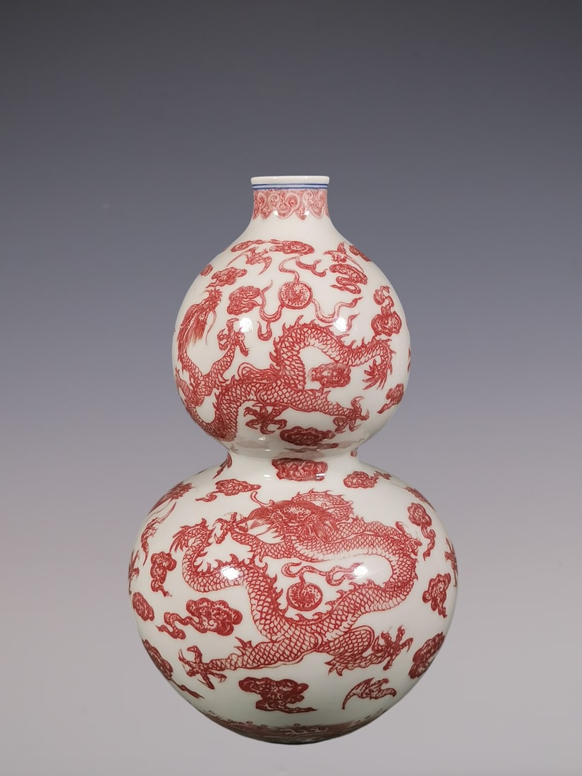 An Exquisite Underglaze-Red Dragon Pattern Seawater Pattern Gourd-Shaped Vase: An Exquisite Underglaze-Red Dragon Pattern Seawater Pattern Gourd-Shaped Vase Qing Dynasty, China Qianlong Six-character Mark Size:11.8inx7.3in釉里红五龙葫芦&