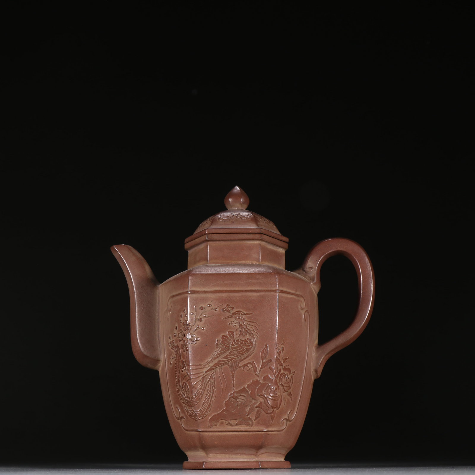 An Exquisite Purple Sands Flower and Bird Pattern Teapot: An Exquisite Purple Sands Flower and Bird Pattern Teapot Qing Dynasty, China Size:6.1inx5.6in紫砂六方宫灯壶 中国清代 Size:15.5cmx14.3c