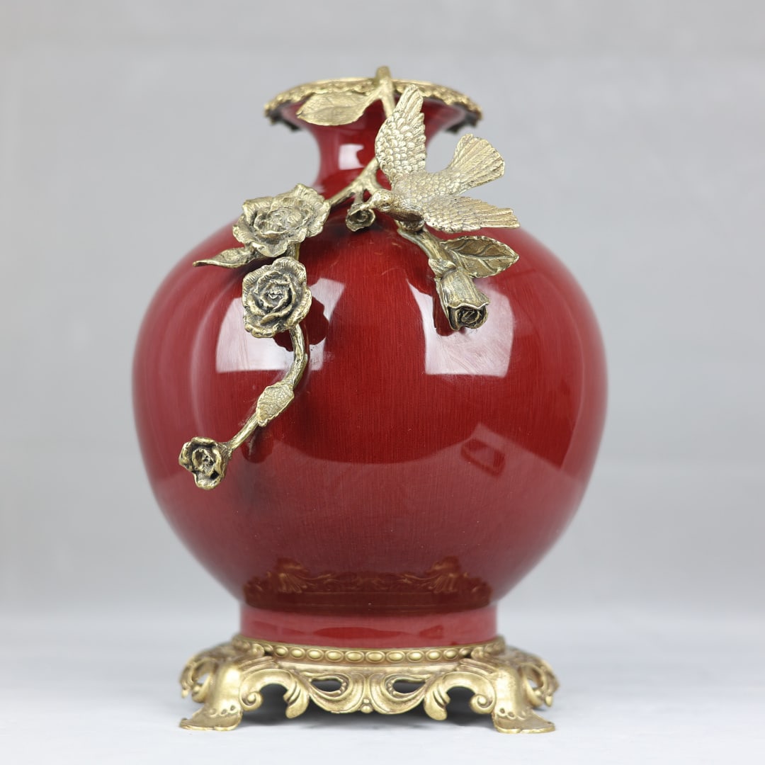 An Exquisite Lang yao Red Glazed Inlaid Bronze Flower and Bird Pattern Vase: An Exquisite Lang yao Red Glazed Inlaid Bronze Flower and Bird Pattern Vase Qing Dynasty, China Qianlong Six-character Mark Size:13inx9.8in郎红釉镶铜花鸟ŏ