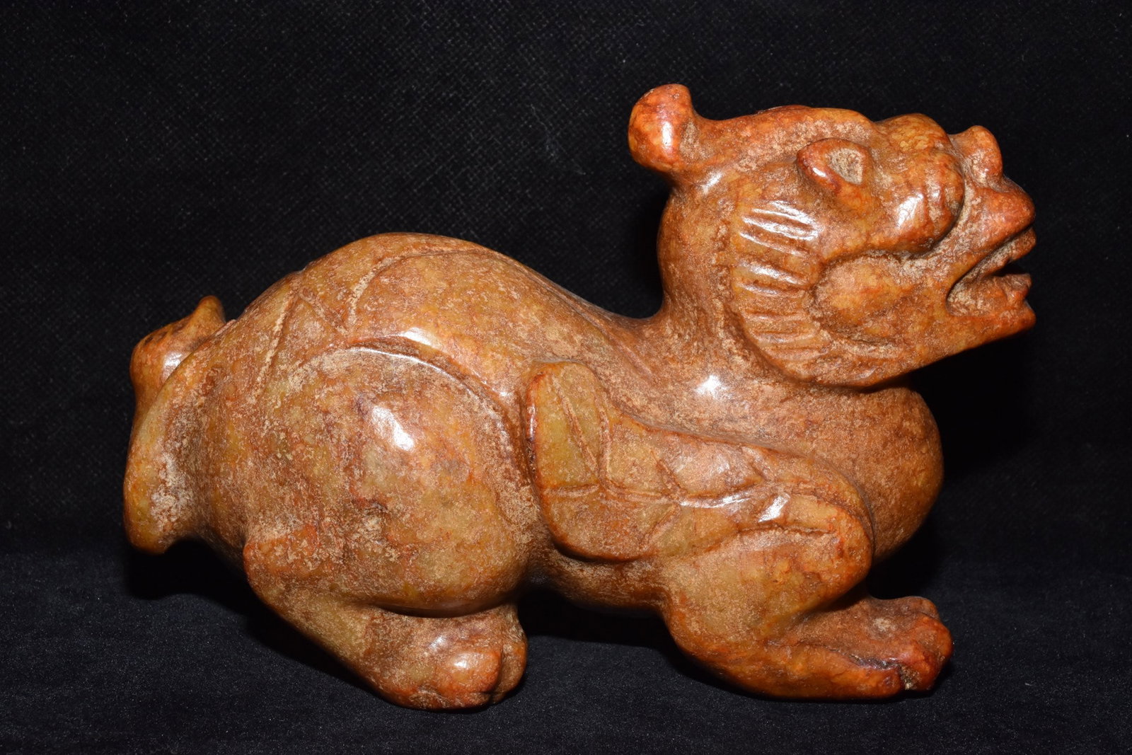 An Exquisite Hemo Jade Auspicious Beast Ornament (1 of 6)