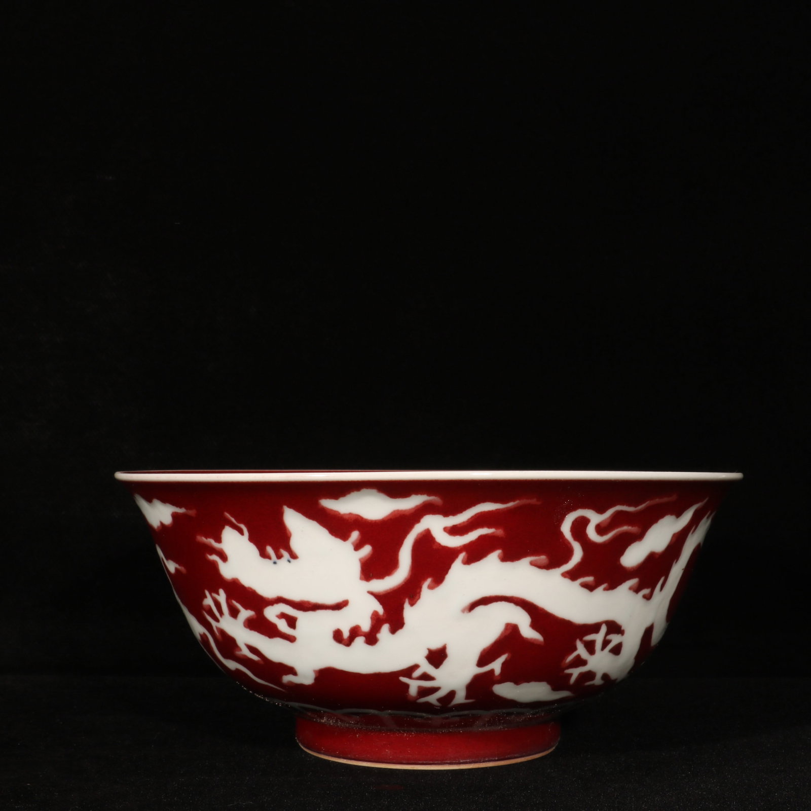 An Exquisite Ji Red Glazed Auspicious Cloud and Dragon Pattern Bowl: An Exquisite Ji Red Glazed Auspicious Cloud and Dragon Pattern Bowl,Ming Dynasty,China,Xuande Six-character Mark,Size:3.8inx8.6in 霁红釉祥云龙纹碗,È