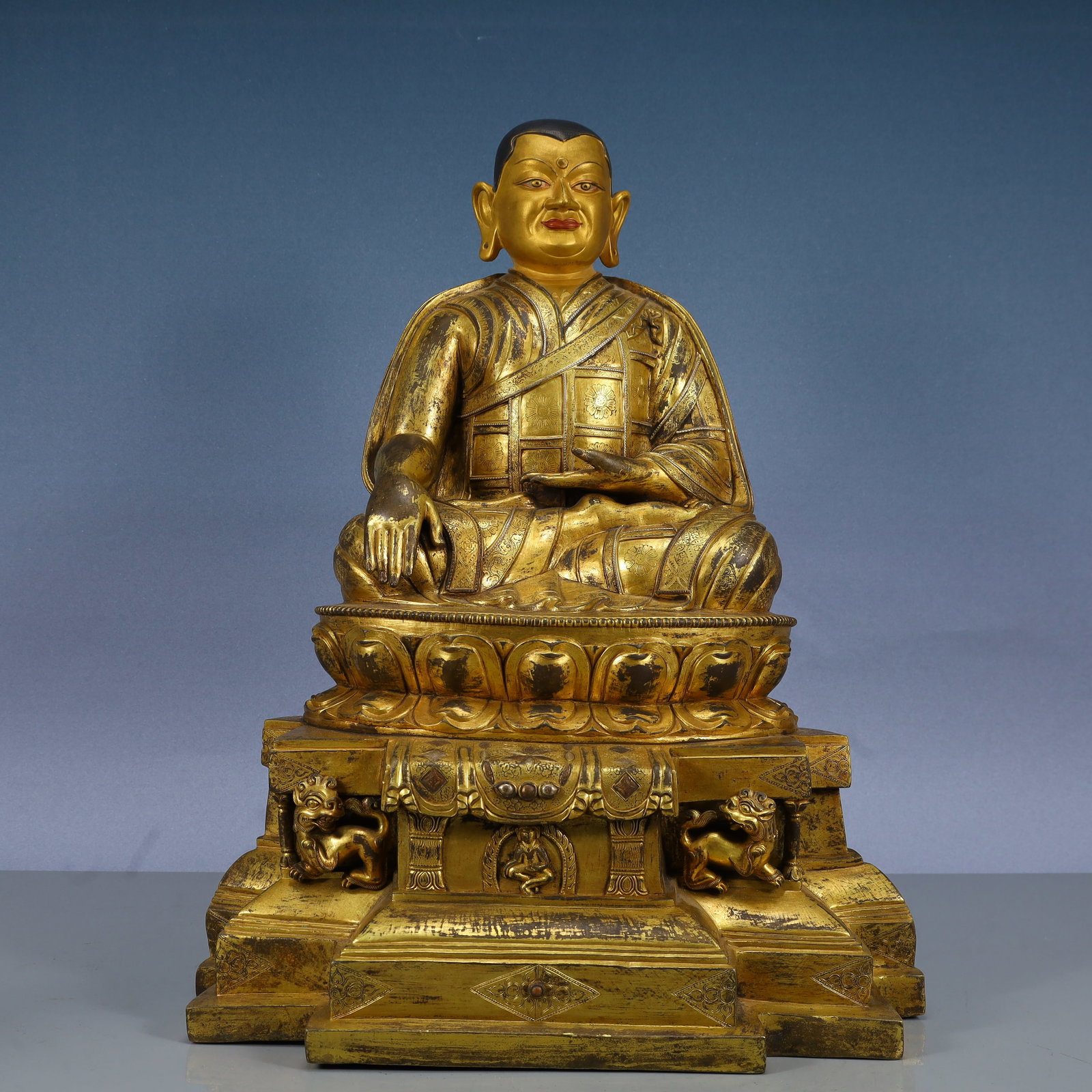 A Solemn Gilt Bronze Statue of Guru,With Inscription: A Solemn Gilt Bronze Statue of Guru,With Inscription,Qing Dynasty, China,Size:15inx11.4inx19.7in,Weight:18850g 铜鎏金上师像,带铭文,中国