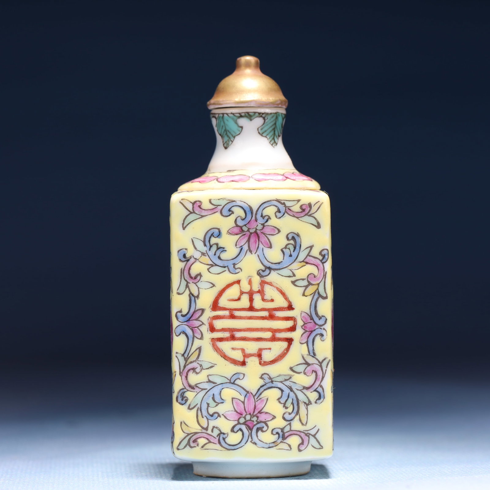 An Exquisite Yellow Ground Enamel Lotus Pattern Bottle: An Exquisite Yellow Ground Enamel Lotus Pattern Bottle,Qing Dynasty,China,Qianlong Four-character Mark,Size:1.4inx3.5in,Weight:96g 黄地珐琅彩缠枝莲ń