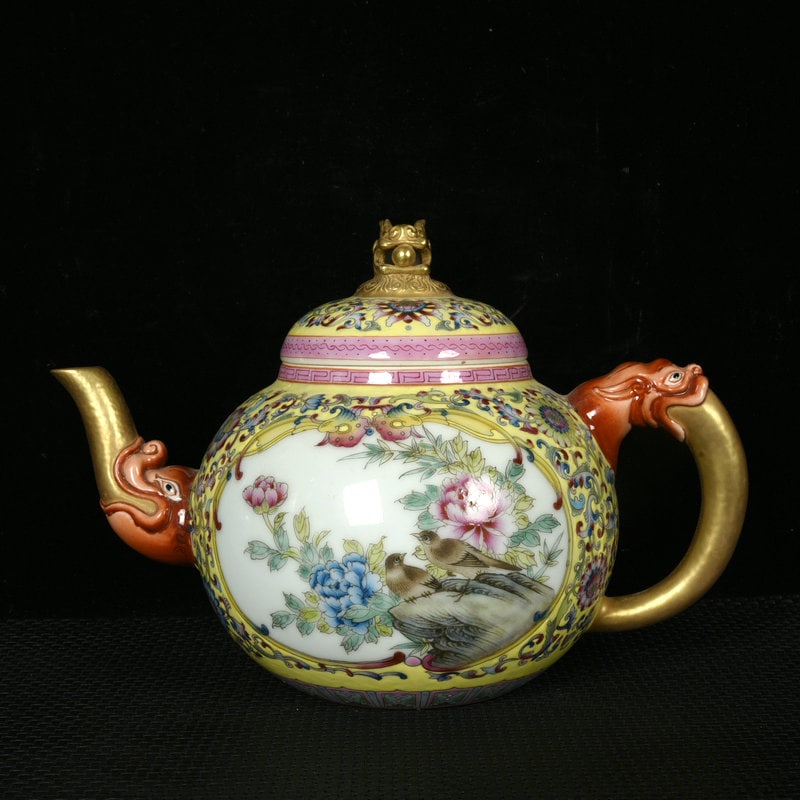 An Exquisite Yellow Ground Enamel Flower and Bird Pattern Teapot: An Exquisite Yellow Ground Enamel Flower and Bird Pattern Teapot,Qing Dynasty,China,Qianlong Four-character Mark,Size:7.7inx10.6inx6.5in 黄地珐琅彩花鸟纹