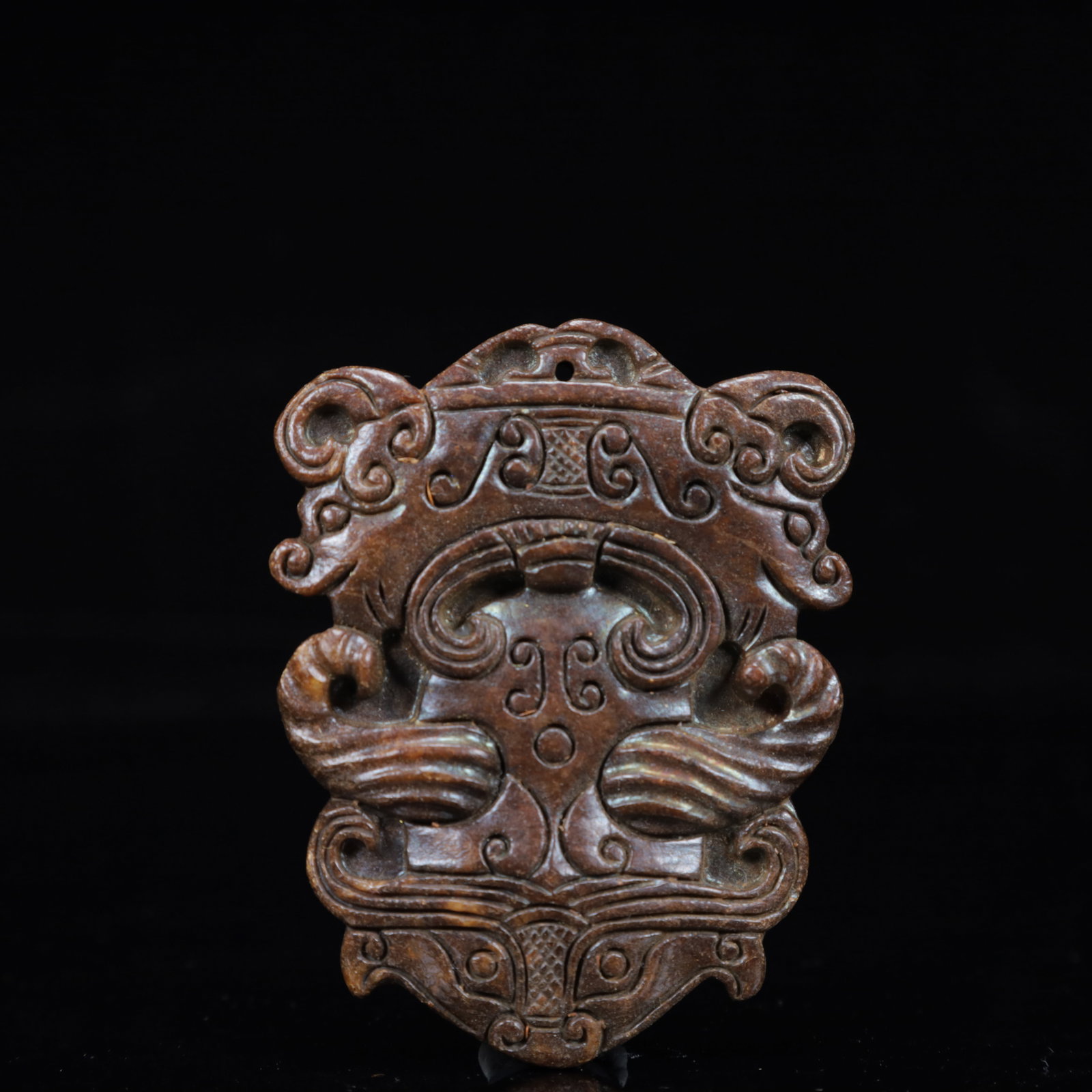 A Rare Gaogu yu Beast-Face Pendant: A Rare Gaogu yu Beast-Face Pendant,Ancient Time,China,Size:2.4inx0.3inx3.1in,Weight:67g 高古玉兽面挂件,中国远古时期