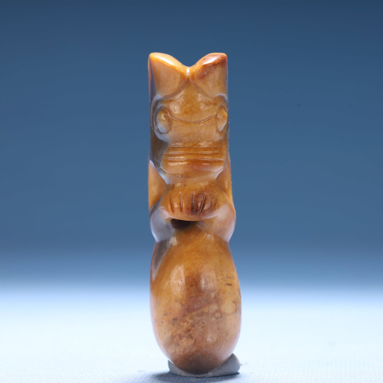 An Archaic Hongshan Culture Yellow Jade Figure Ornament: An Archaic Hongshan Culture Yellow Jade Figure Ornament,Ancient Time,China,Size:1.1inx0.7inx2.7in,Weight:61.3g 红山文化黄玉人物摆件,中