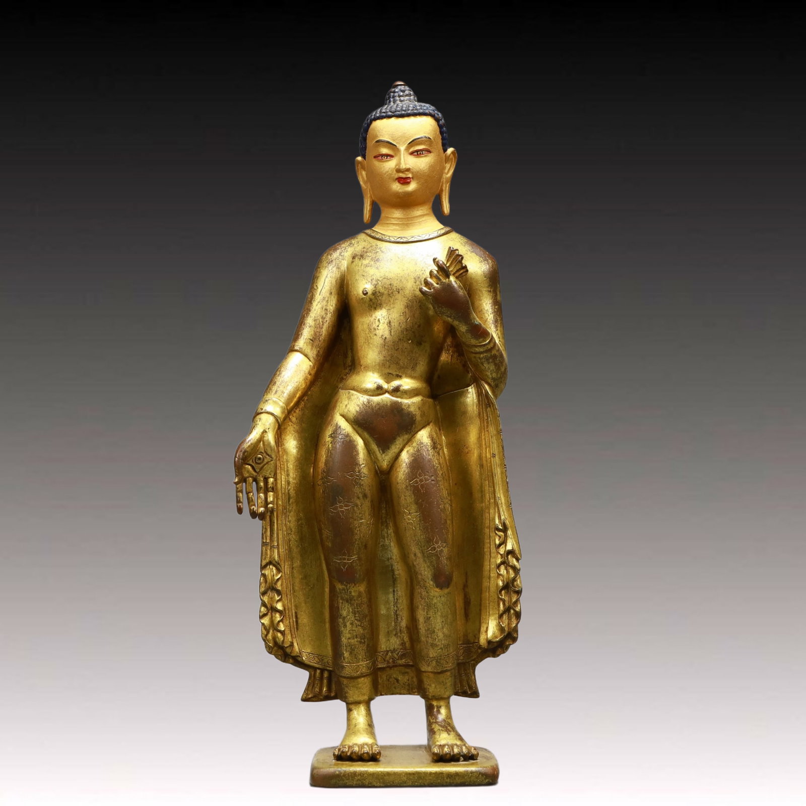 A Solemn Gilt Bronze Statue of Sakyamuni: A Solemn Gilt Bronze Statue of Sakyamuni,Ming Dynasty, China,Size:6.3inx2.8inx15in,Weight:4000g 铜鎏金释迦摩尼像,中国明代