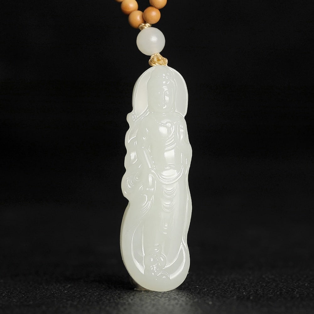 An Exquisite White Jade Statue of Avalokitesvara Pendant: An Exquisite White Jade Statue of Avalokitesvara Pendant,Size:1.5inx0.5inx0.3in 白玉观音像挂件