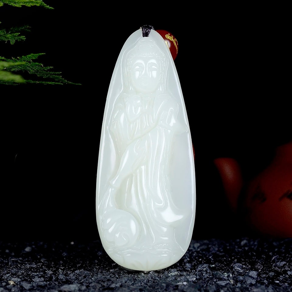 An Exquisite White Jade Statue of Avalokitesvara Pendant: An Exquisite White Jade Statue of Avalokitesvara Pendant,Size:2inx0.8inx0.3in 白玉观音像挂件