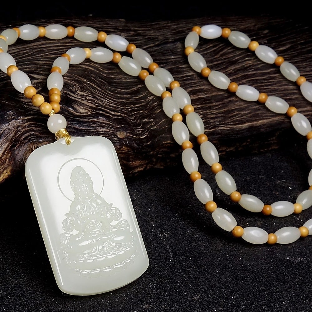 An Exquisite White Jade Statue of Avalokitesvara Pendant: An Exquisite White Jade Statue of Avalokitesvara Pendant,Size:1.9inx1.1inx0.4in 白玉观音像挂件